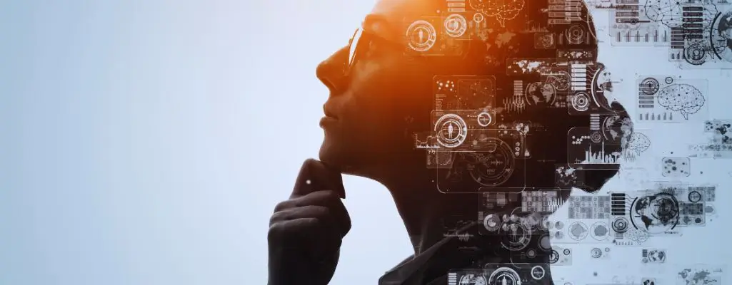 Jak rozpocząć pracę z GPT, pisać prompty i prowadzić rozmowy z AI? Część druga przewodnika dla niewidomych 1 Obrazek wyróżniający do artykułu - jak rozpocząć pracę z gpt? Na zdjęciu widoczny jest profil osoby, najprawdopodobniej kobiety, która przyjęła zamyśloną postawę – jej ręka opiera się na podbródku, co sugeruje głęboką refleksję lub analizę. Kobieta ma na sobie okulary, a jej twarz oraz część głowy z prawej strony stopniowo przechodzi w cyfrowe, futurystyczne elementy graficzne, takie jak ikony, wykresy, symbole technologiczne oraz wzory przypominające schematy komputerowe. Tło zdjęcia jest jasne, co sprawia, że kontrast między realistyczną sylwetką a abstrakcyjnymi, cyfrowymi elementami jest wyraźny. Całość wywołuje skojarzenia z nowoczesną technologią, sztuczną inteligencją i myśleniem przyszłościowym.